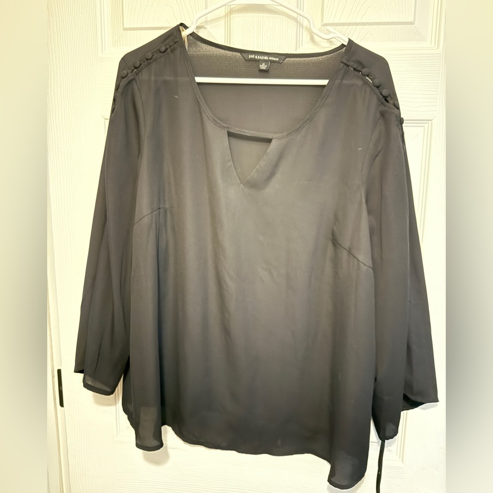 Adorable black top with great sleeve detail!